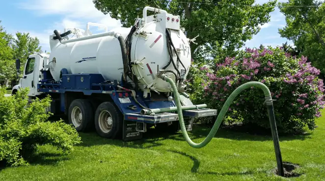 Professional vacuum truck performing residential drainage and septic maintenance in Atlanta, GA